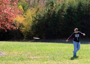 Employees playing frisbee