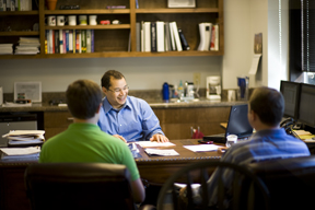 Sealevel engineers Todd Gustafson and Greg Harrison meet with Tony Martin, director of R&D