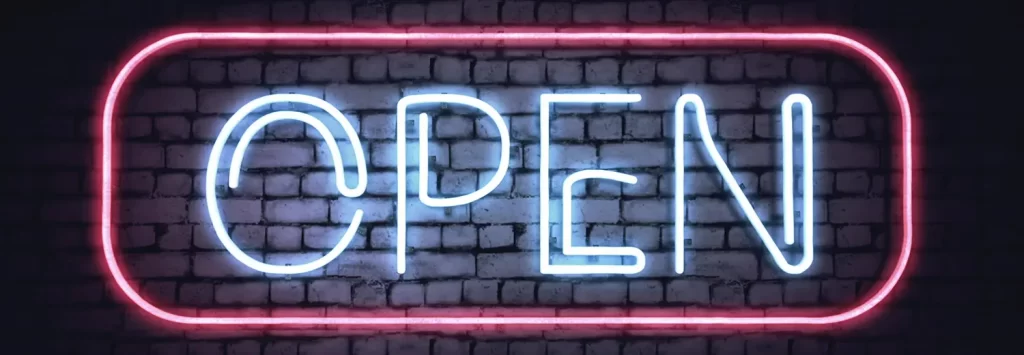 Neon OPEN sign on a white brick wall. Illustration.