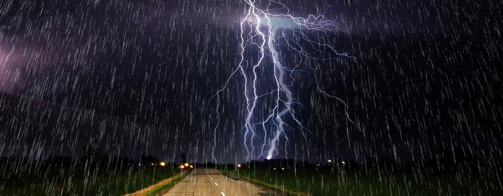 A lightning strike in a driving storm