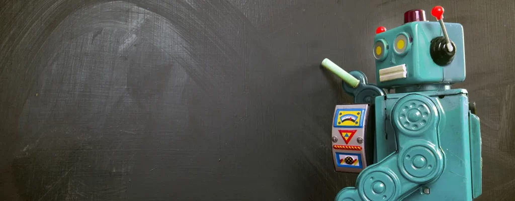 A robot writing on a chalkboard