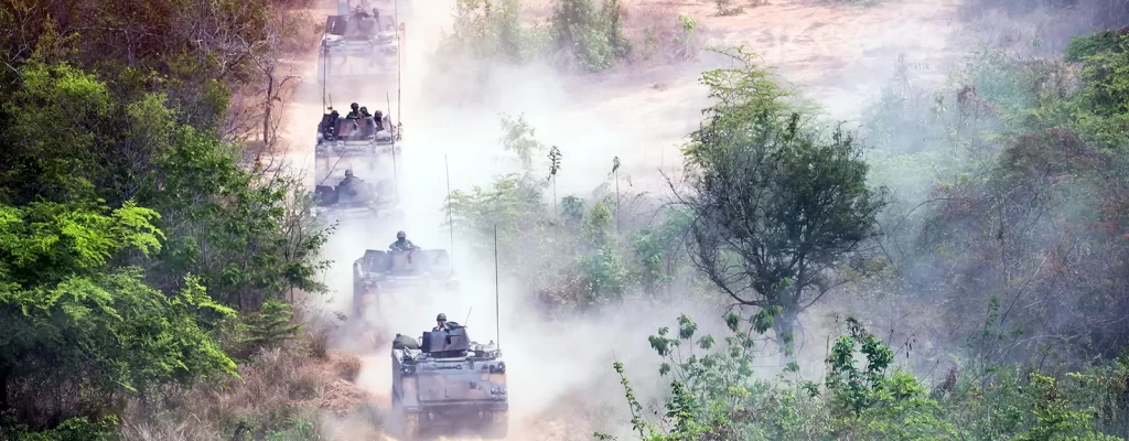 Tanks driving through a cloudy jungle